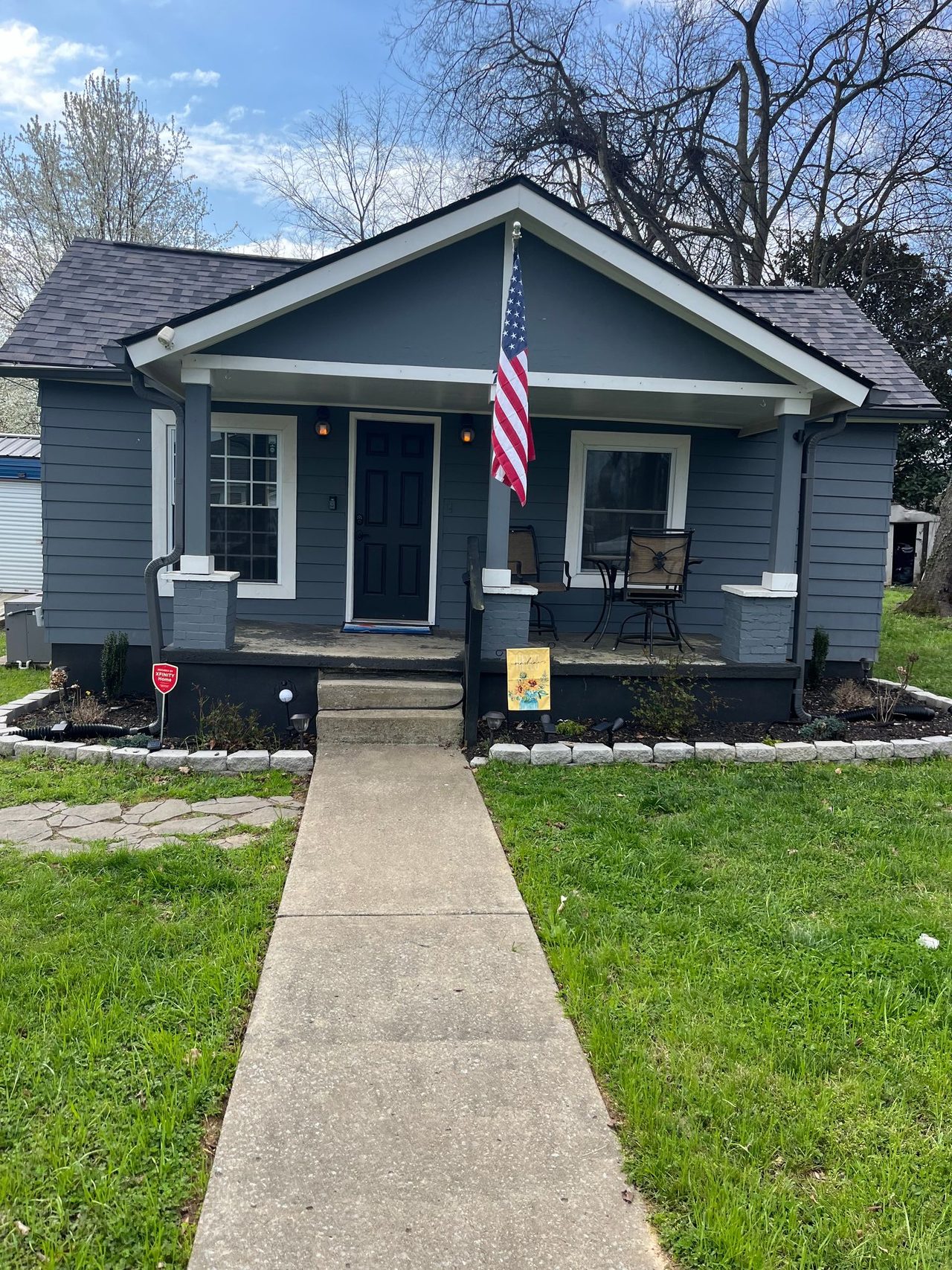 Craftsman bungalow with new siding and freshly trimmed porch columns and windows