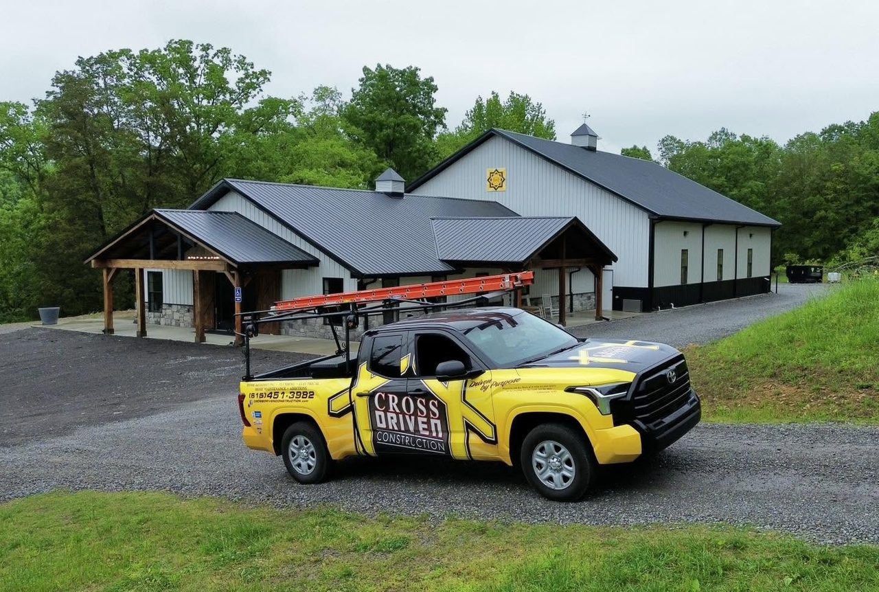 A yellow Cross Driven Construction pickup parked outside the company's shop in Hendersonville, Tennessee
